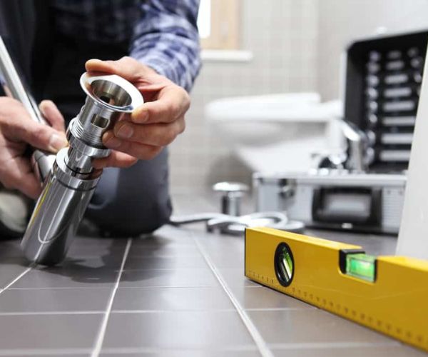 Plumbing and air conditioning service technician working